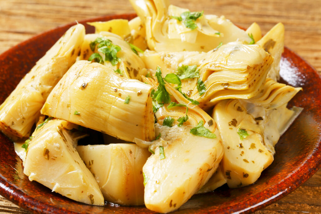 Artichoke hearts dressed in oil and herb marinade